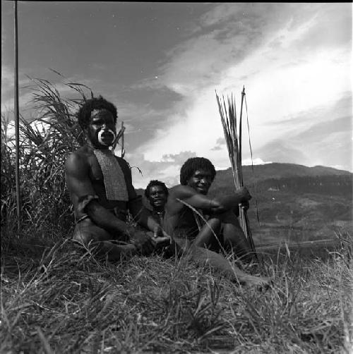 Yegé Asuk and Weaklekek sit during a lull in war