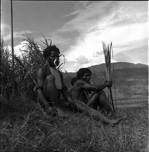 Yegé Asuk and Weaklekek sit during a lull in war