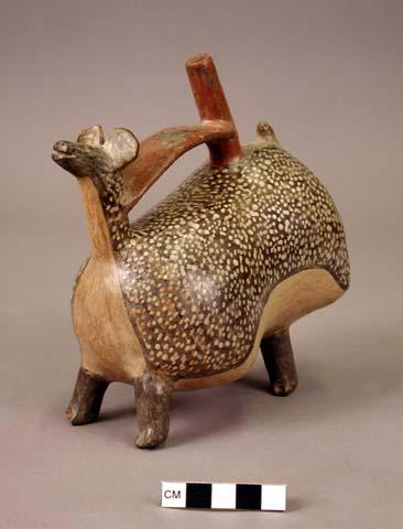 Ceramic spout and bridge bottle, molded, polychrome 4-leg animal effigy