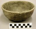 Ceramic bowl, punctate/notched pattern on outside rim, rim chipped, body cracked