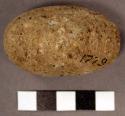 Possible rasping stone. short, cylindrical large pebble. possible pecking. coars