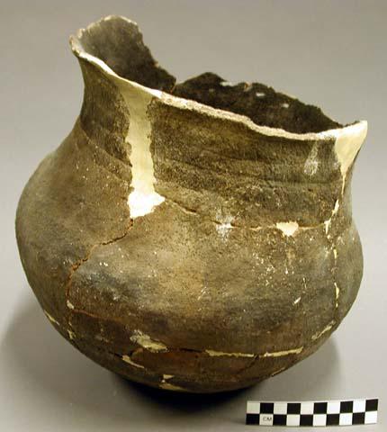 Ceramic jar, flared rim, banded neck, reconstructed, sherds missing