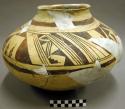 Black-on-yellow pottery jar, restorable?