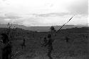 Men running crouched, away from the enemy on the Tokolik