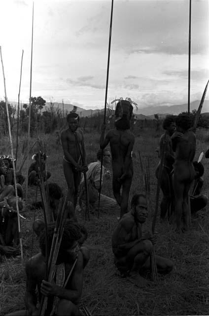 Peter Matthiessen and a group of warriors waiting on the Tokolik