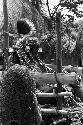 Women near the pia (chair) containing Ekiarotmilek, covered with woven cowrie shell strands