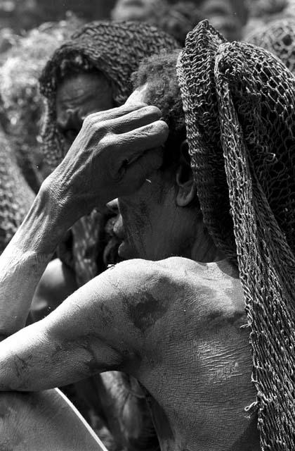 Close shot of a mourning woman