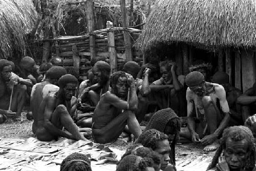 Men's group; sitting and smoking