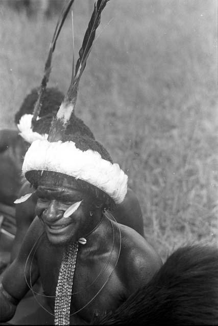 Another man in a white feather headdress