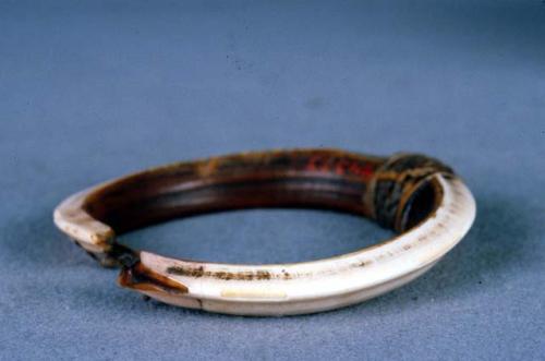 Boar tusk armlets, worn by men on each arm