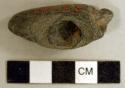 Ground stone, pipe bowl, with incised decoration, possible animal effigy figure