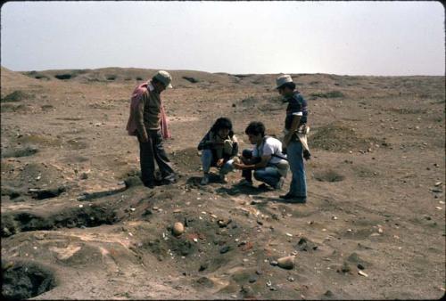 Crew looking at looted tomb