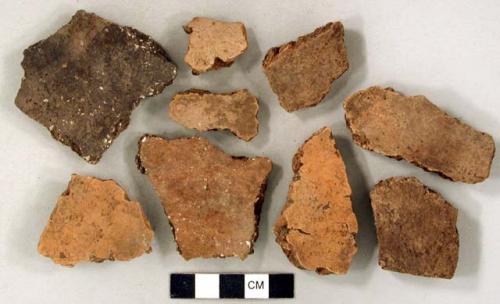 Coarse earthenware body and rim sherds, undecorated, some with shell temper