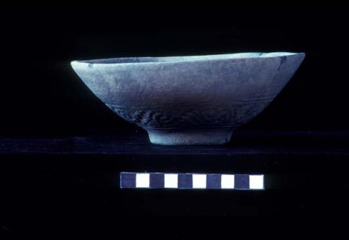 Pedestaled base bowl with low relief design from Site 94