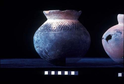 Short everted neck jar with press molded lines and dots from Site 94, and paddle stamped C-neck jar from Site 94