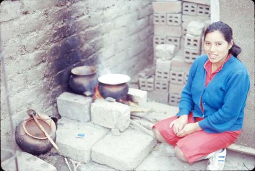 Consuelo cooking on roof