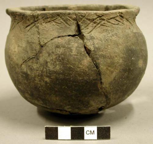 Ceramic complete vessel, mended, incised around rim