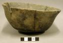 Ceramic complete vessel, mended, incised design around rim