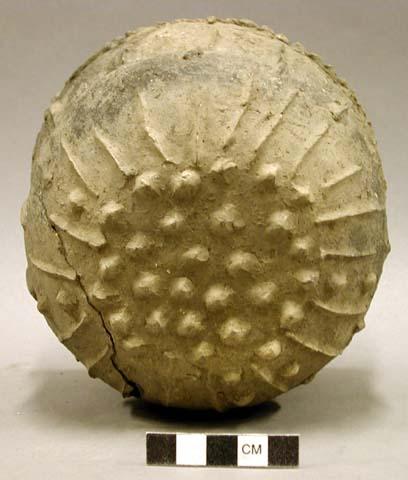 Ceramic vessel, incised rim, nubbed bottom, raised pattern on body