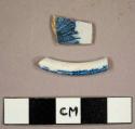 Transferprint creamware foot ring sherd and tin-glazed earthenware sherd with blue sponge print