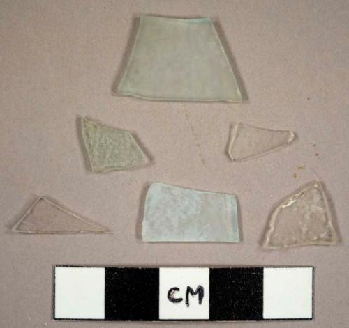 Colorless window glass fragments, including two with possible etched lines