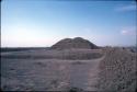 View of huaca from compound at Site 142