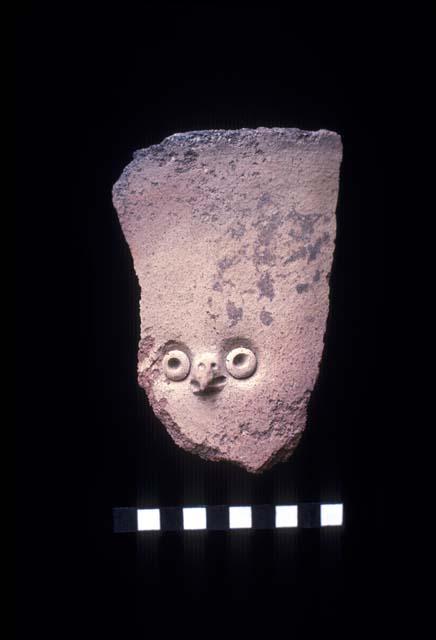 Tall everted jar neck with white slip and applique and punctate owl face from Site 139