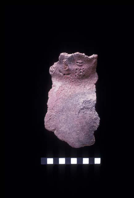 Everted applique and punctate crying face neck from Site 130