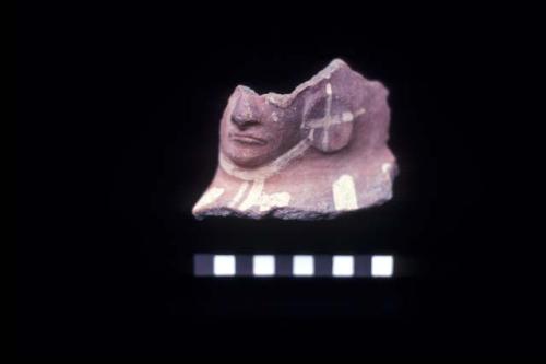 Ceramic waster sherd with molded warrior face from Site 133