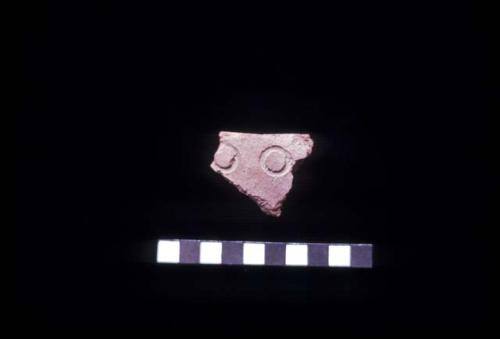 Sherd from cane stamped closed bowl from Site 128