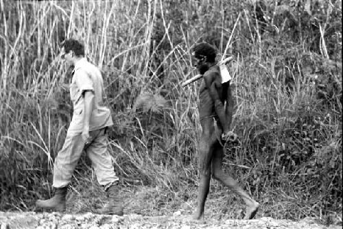 Jan Broekhuijse and a man walking with a steel axe