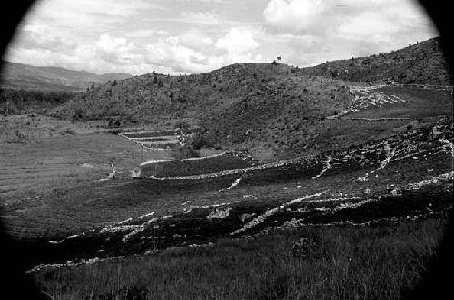 View of Baliem countryside; hills and rock wall garden borders