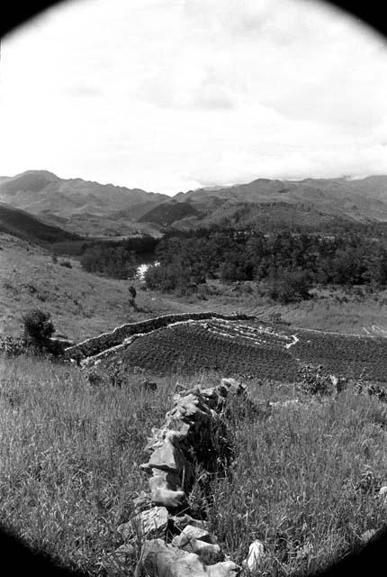 View of terrace and garden walls; river and hills in the distance