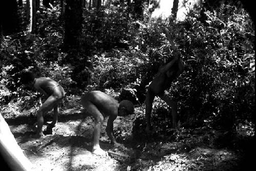 Boys clearing the ground