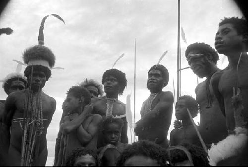 Shot from below standing group of warriors at an Etai