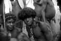 Young smiling warriors look towards the camera at an Etai on the Liberek