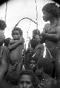 Young warriors standing and sitting at an Etai on the Liberek