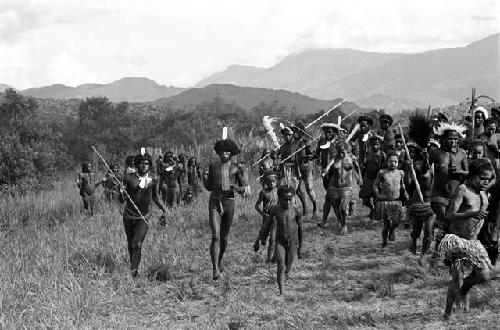 Large group of men and women dancing at an Etai