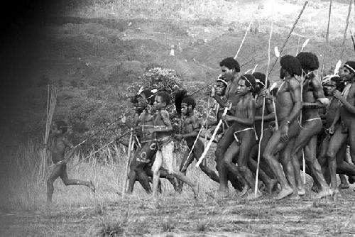 Boys leading men in the dance at an Etai