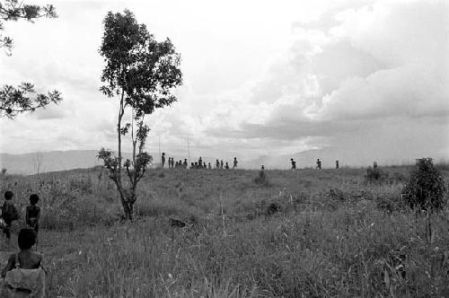 Men gathering on the Tokolik; some boys in the foreground