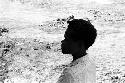 Unknown boy standing on the beach in Biak