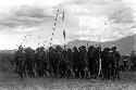 Group of men dancing with spears at an Etai