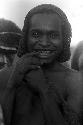 Man from Yalimo smiling at the camera during an Etai