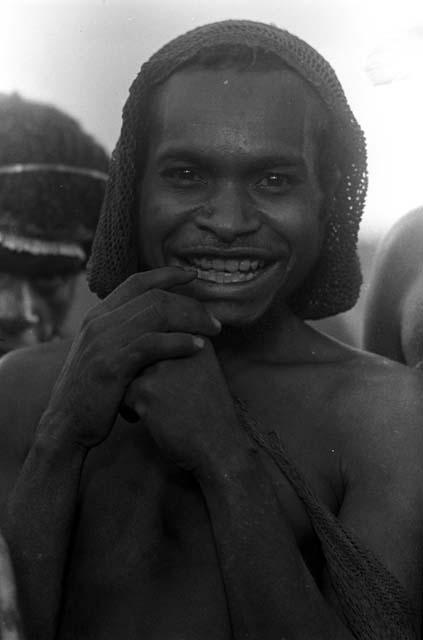Man from Yalimo smiling at the camera during an Etai