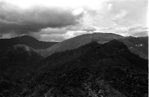 View of hills near the salt wells; distant storm on left