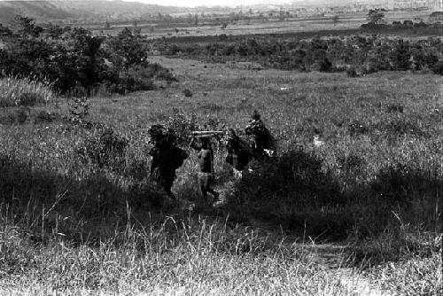 Group of women carrying working materials from the salt wells