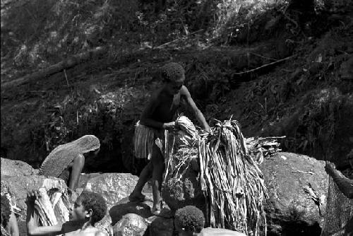 Women and children working at the salt well