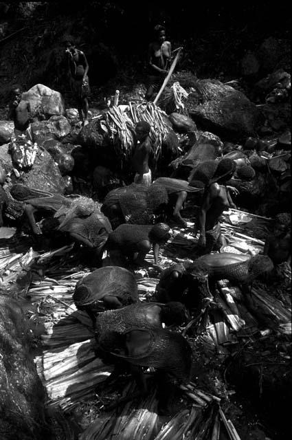 View from above women and children working in the salt well