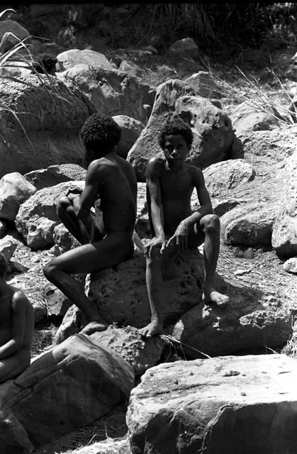 Men among the rocks above the salt well where women are working