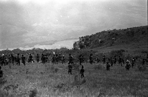 Men on their way to the battle front; river and hills beyond